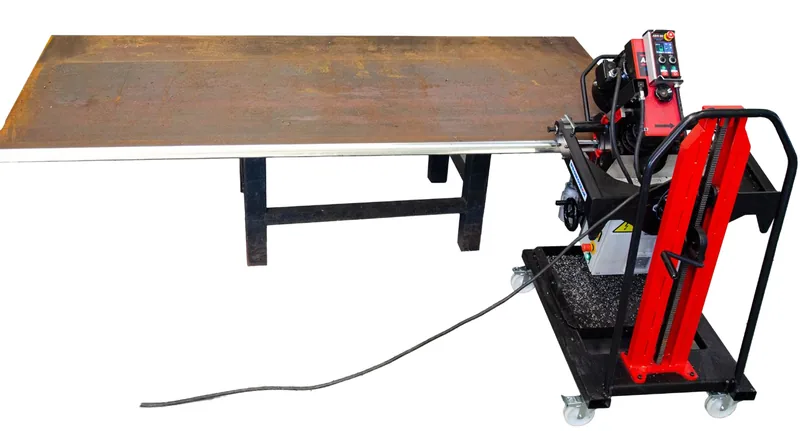 PROMOTECH ABM-50 auto-feed plate beveller working on a plate edge
