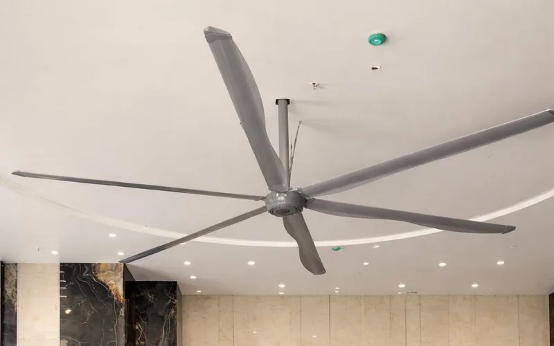 Sudha HVLS fan installed over a high-ceilinged hall